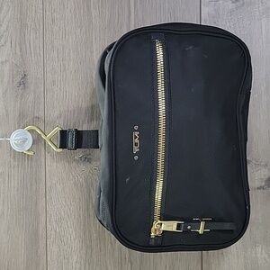 Tumi Black Cosmetic Bag with Gold Accents